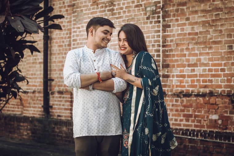 A couple sharing a candid, happy moment together.
